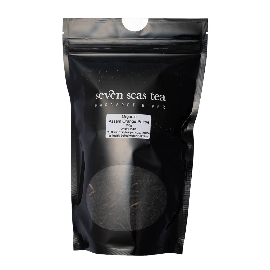 Black Seven Seas Tea pouch of Organic Assam Orange Pekoe with a window showing the leaf