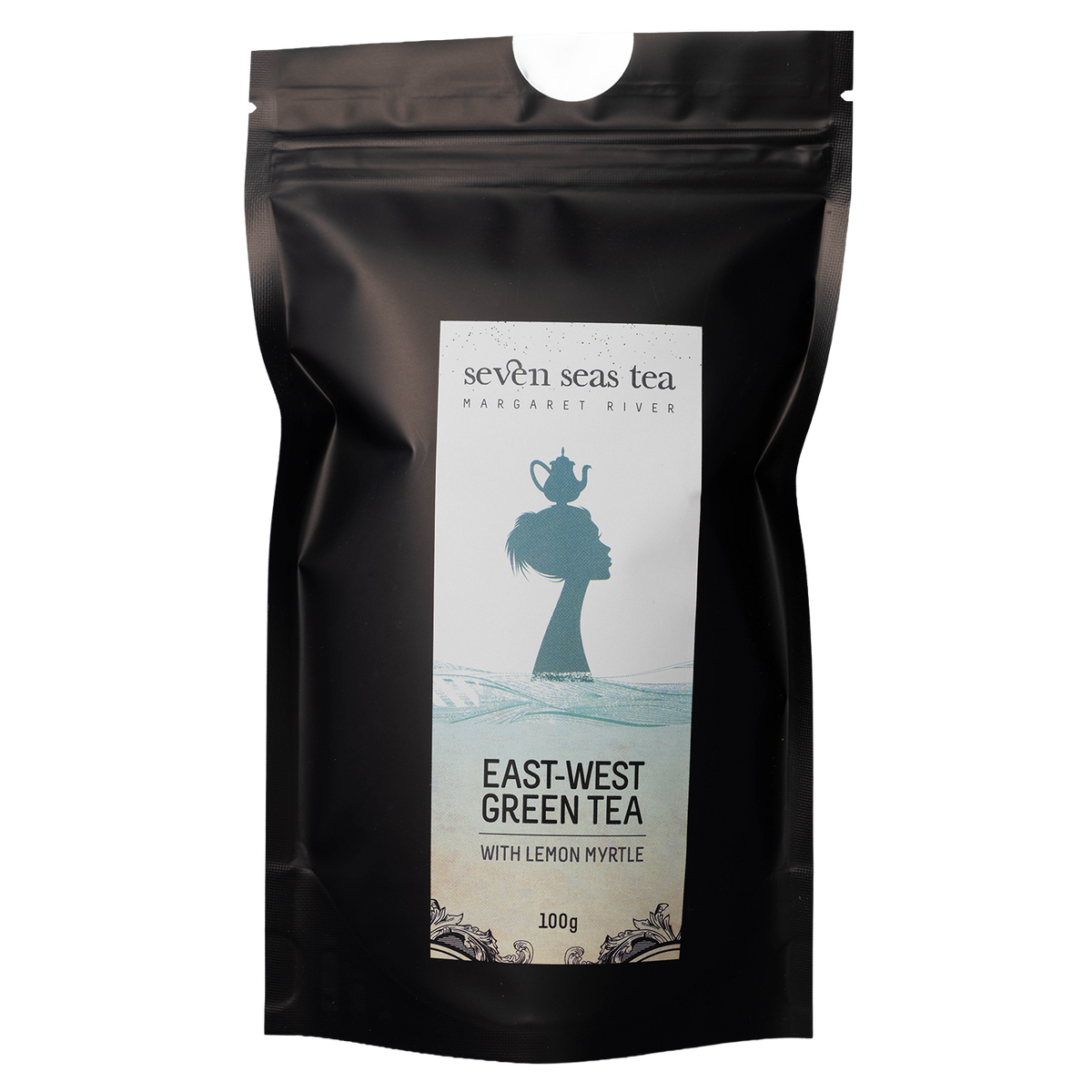 Black pouch of East West Green With Lemon Myrtle with a window showing the leaf