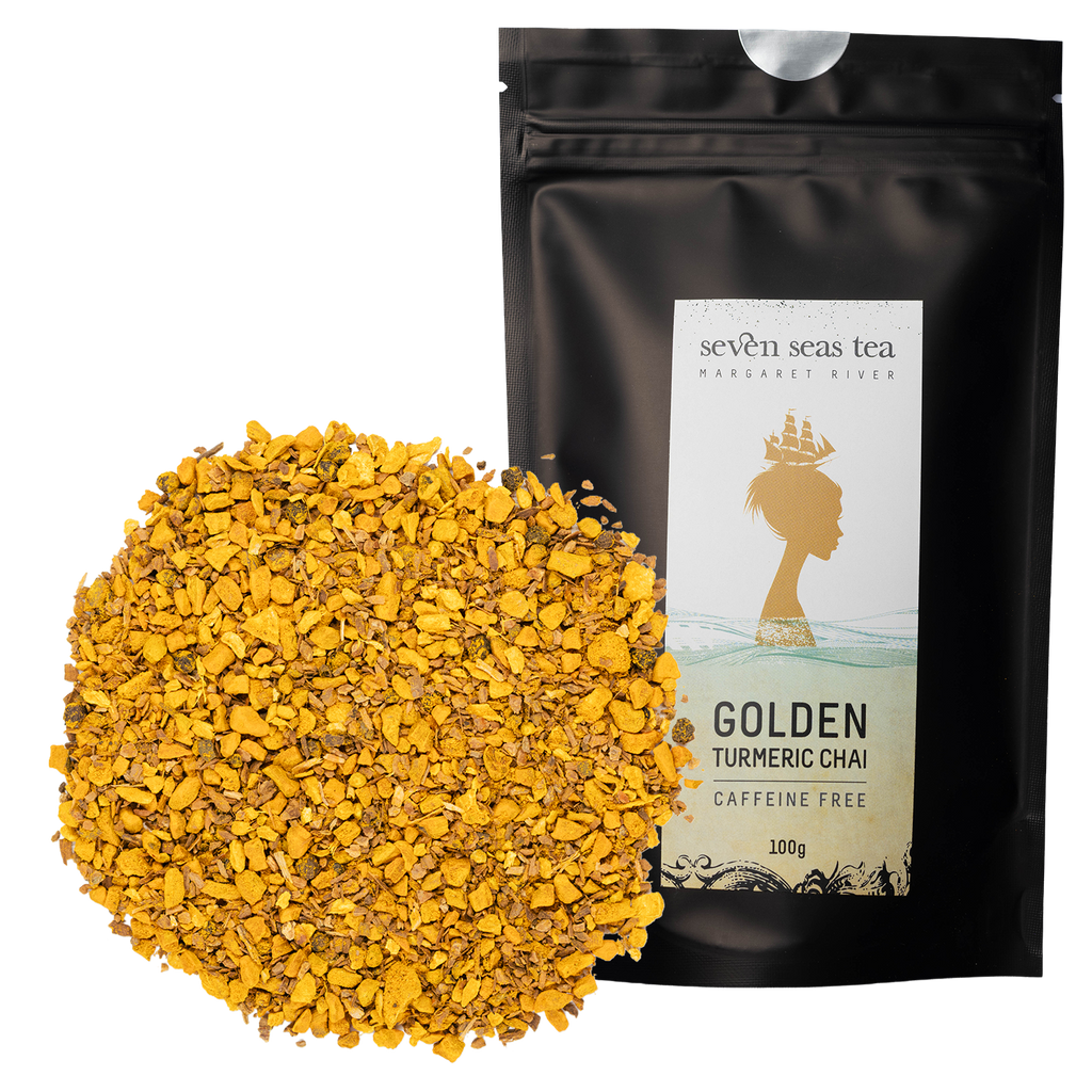 Loose leaf Golden Turmeric Chai piled beside its black Seven Seas Tea pouch