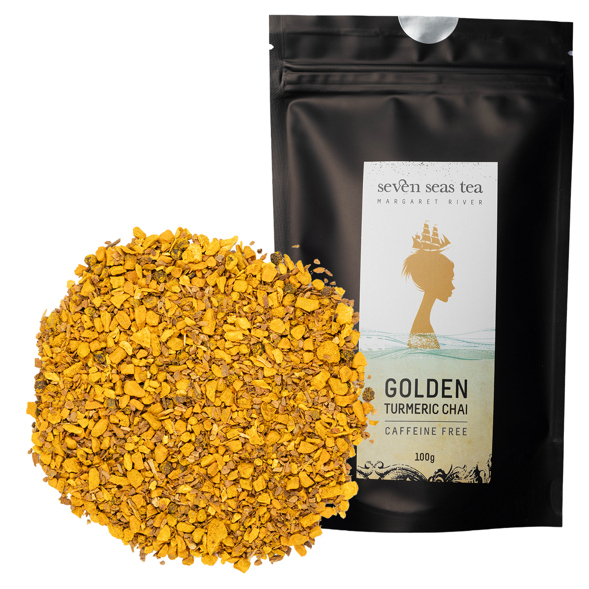 Loose leaf Golden Turmeric Chai piled beside its black Seven Seas Tea pouch
