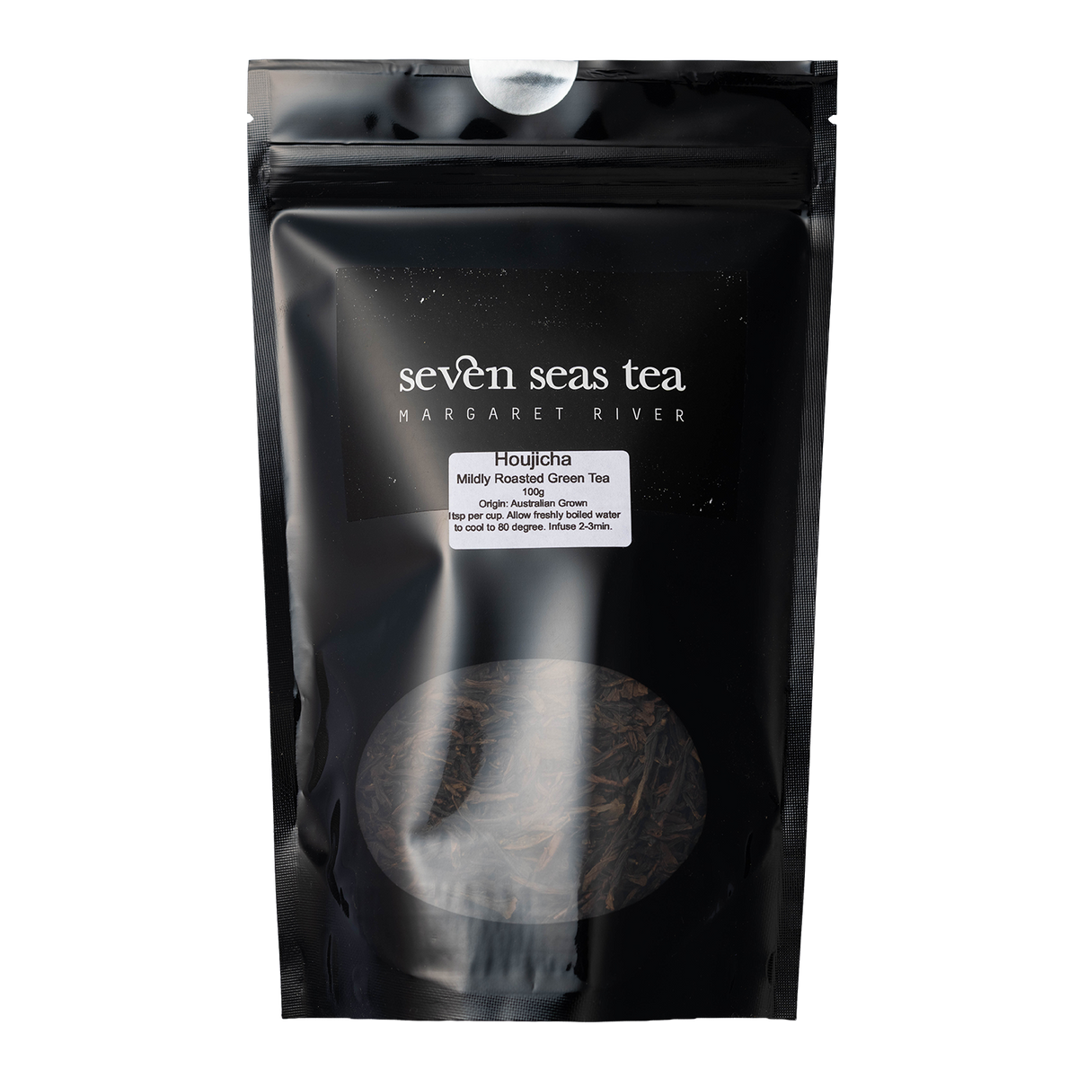 Black Seven Seas Tea pouch of Houjicha Green with a window showing the leaf