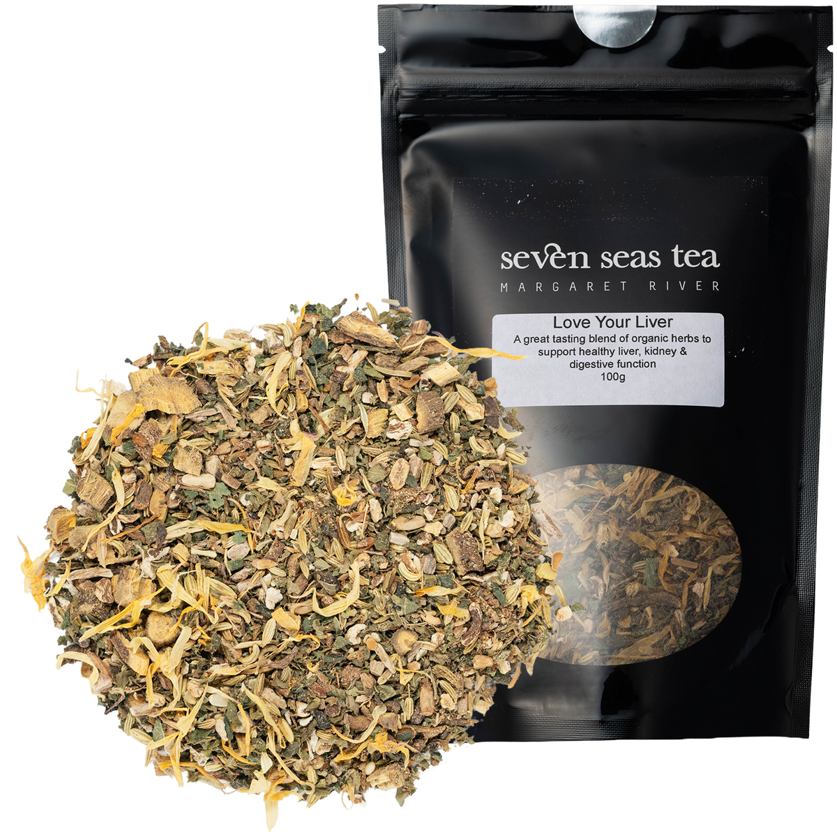 Loose leaf herbal blend piled beside a black Seven Seas Tea pouch labelled Love Your Liver