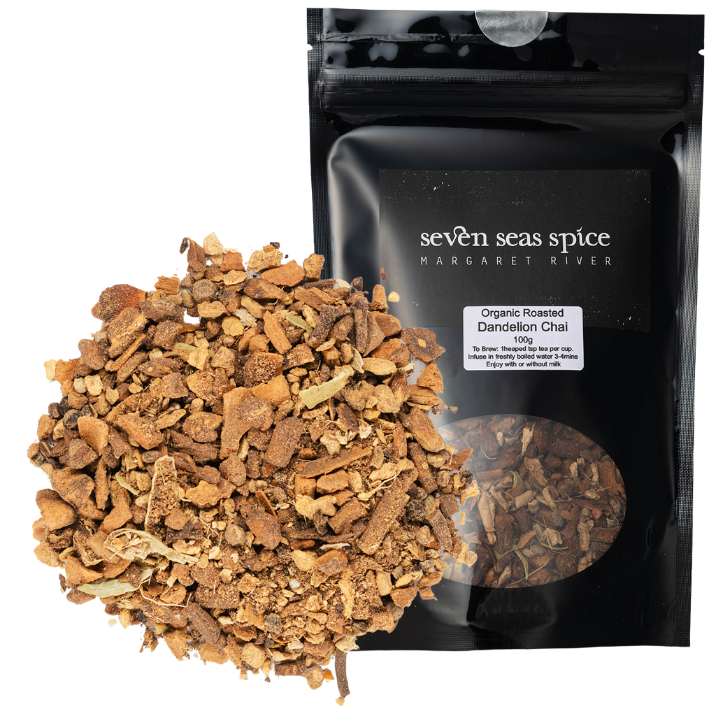 Loose leaf Organic Dandelion Chai piled beside its black Seven Seas Tea pouch
