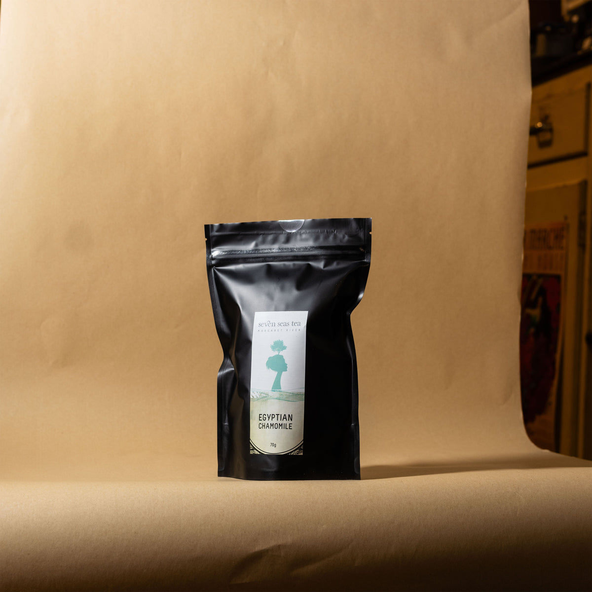 Organic Egyptian Chamomile pouch on a brown paper backdrop, Seven Seas Tea Margaret River