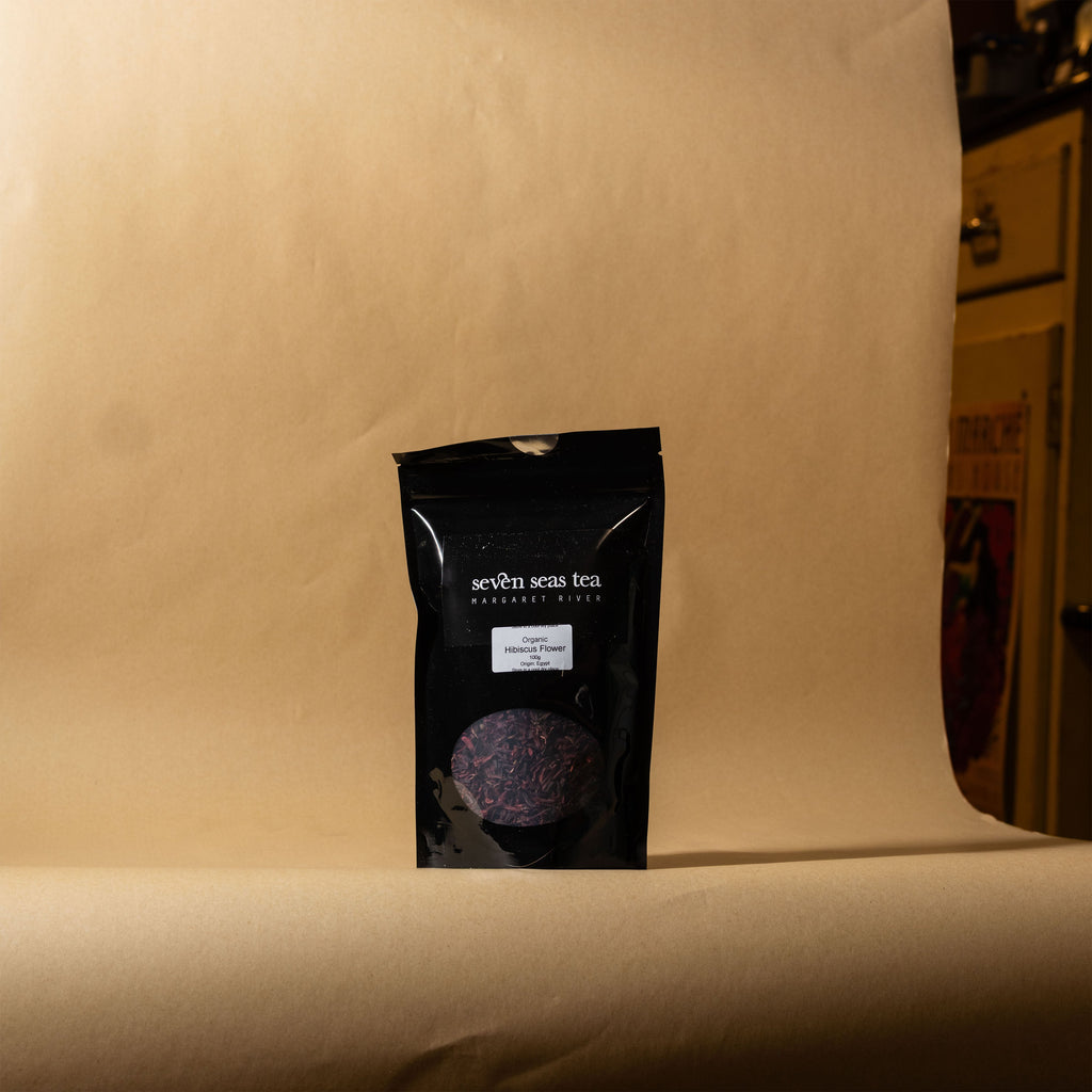 Organic Hibiscus Tea pouch on a brown paper backdrop, Seven Seas Tea Margaret River