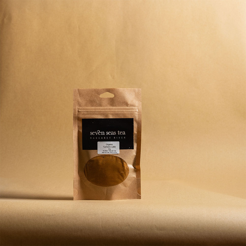 Organic Turmeric Latte kraft pouch on a brown paper backdrop, Seven Seas Tea Margaret River