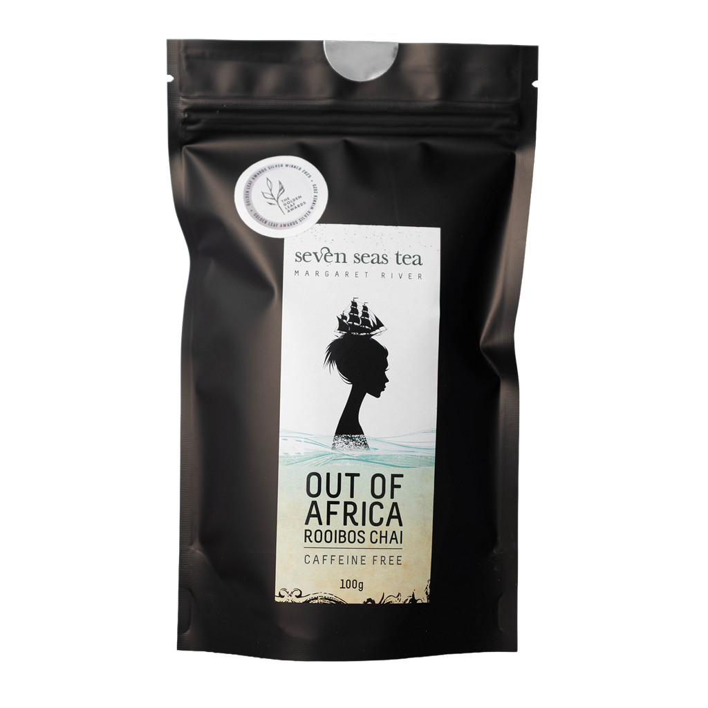 Black pouch of Out of Africa Organic Rooibos Chai with a window showing the leaf