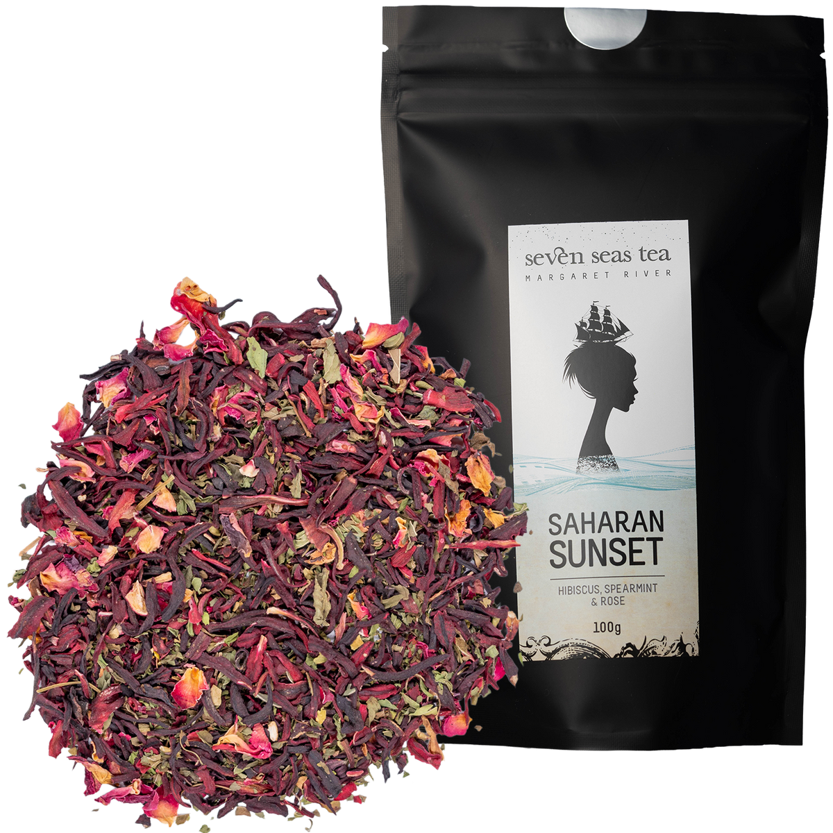 Loose leaf Organic Saharan Sunset piled beside its black Seven Seas Tea pouch