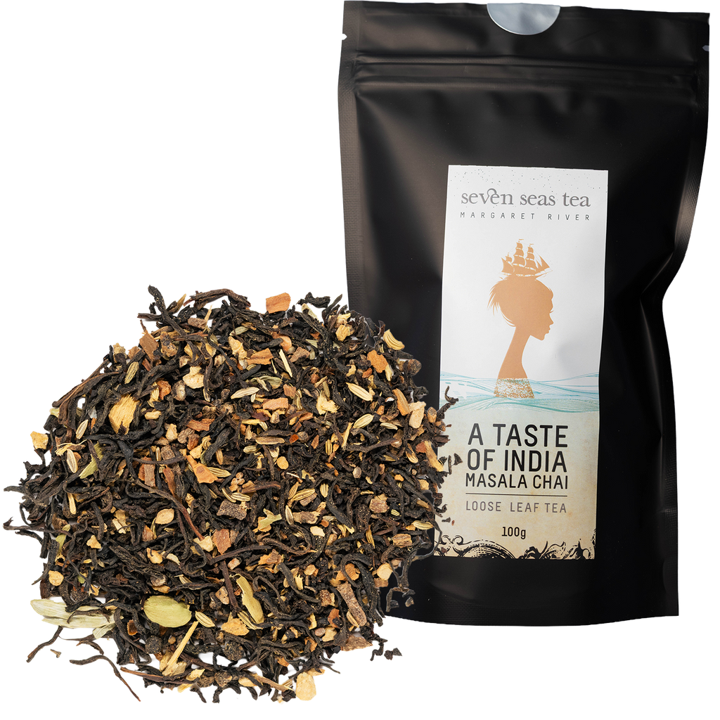 Loose leaf Taste of India Organic Masala Chai piled beside its black Seven Seas Tea pouch