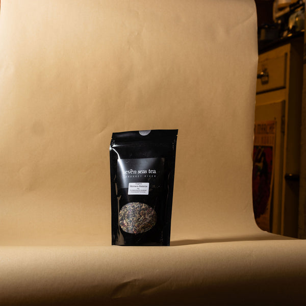 Organic Women's Balancing Blend pouch on a brown paper backdrop, Seven Seas Tea Margaret River